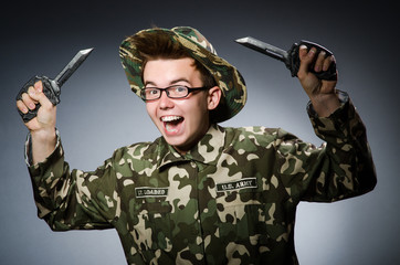 Funny soldier against the dark background