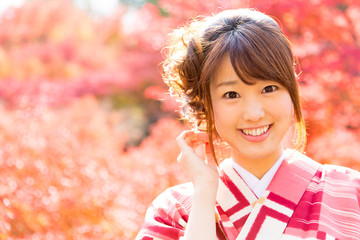 Wall Mural - asian woman wearing japanese kimono in fall