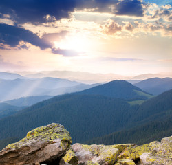 Wall Mural - majestic sunrise over the mountains with sunbeams
