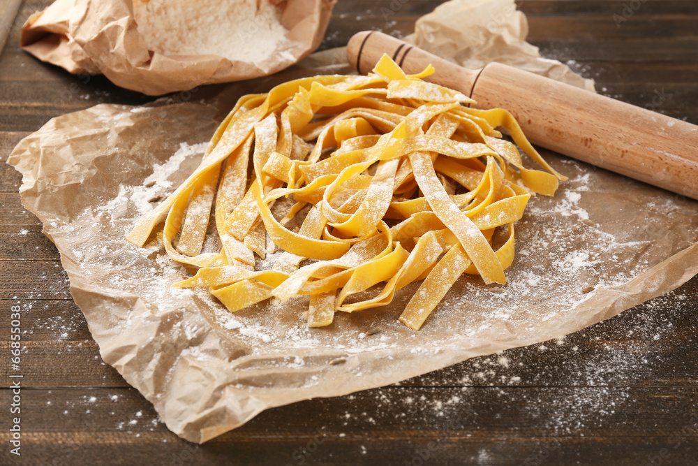 Still life with raw homemade pasta and ingredients for pasta