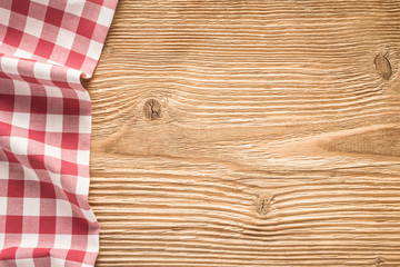 Wall Mural - Tablecloth textile on wooden background