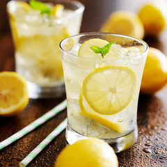 two glasses of lemonade shot close up