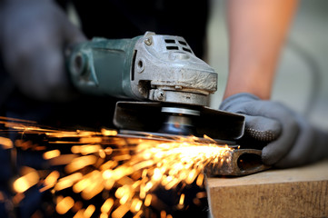 Wall Mural - Worker cutting metal with grinder