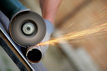 Wall Mural - Worker cutting metal with grinder