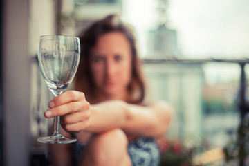 Young woman with glass of wine