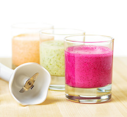 Canvas Print - Fruit smoothie on wooden table on white background