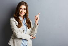 Portrait Of Smiling Business Woman Pointing Finger