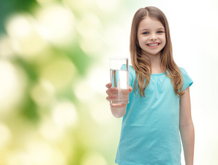 Poster - smiling little girl giving glass of water