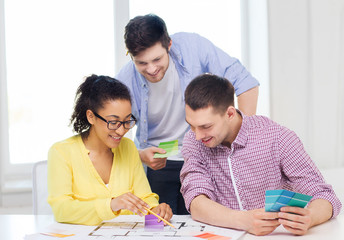 Sticker - smiling interior designers working in office