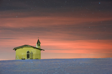 Wall Mural - small church in the mountains at night.