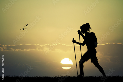 Fototapeta na wymiar Trekking at sunset