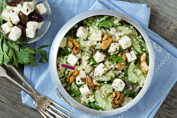 Wall Mural - Salad with cucumber, couscous and feta