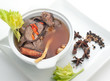 Traditional oriental beef broth with mushrooms