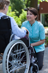 Disabled woman resting in a garden