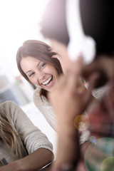 Fototapete - Young people listening to music with headset on
