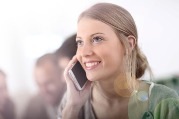 Aufkleber - Portrait of attractive young woman using cellphone