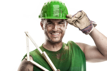 portrait of dirty worker with helmet measuring with classic wood