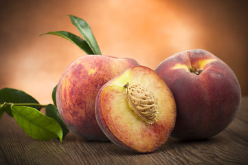 Wall Mural - Fresh peach sliced close up on the table