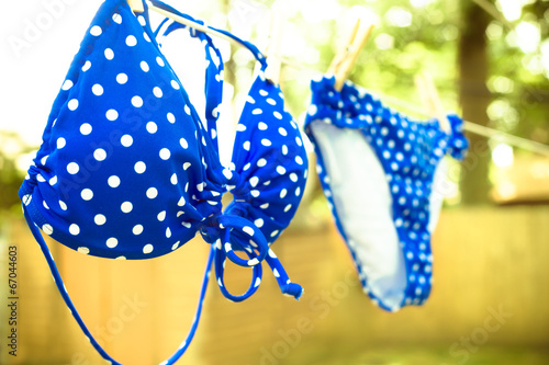 Fotografie, Obraz Retro toned polka dot bikini on clothesline