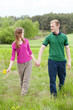 © Photographee.eu - Couple in love walking on meadow
