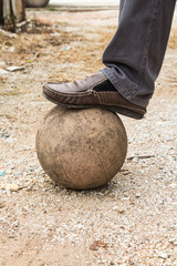 Old ball with his feet