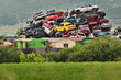 Pile of used cars in junkyard