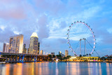 Fototapeta Las - Singapore - June 26, 2014: View from distance to Singapore Flyer