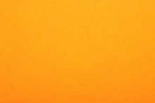 Close Up Of Orange Colored Paper Texture