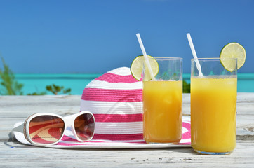 Wall Mural - Sunglasses, hat and orange juice