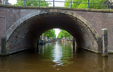 Fototapete - Amsterdam - Romantic bridge over canal in old town