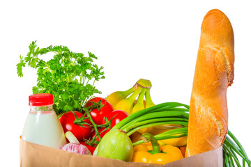 loaf of bread, milk and vegetables in the package on white backg