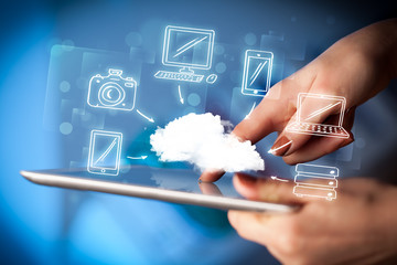 Finger pointing on tablet pc, mobile cloud concept