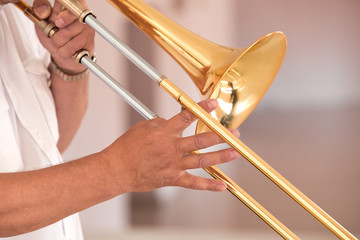 Wall Mural - Hands of the man playing the trombone