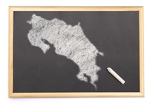 Blackboard With A Chalk And The Shape Of Costa Rica Drawn Onto.