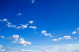 Fototapeta  - blue sky background with tiny clouds
