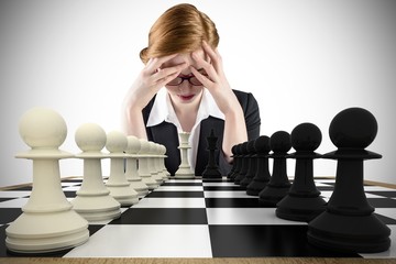 Poster - Composite image of redhead businesswoman with head in hands