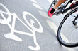 © connel_design - Close up of motion blurred bicyclist in bike lane