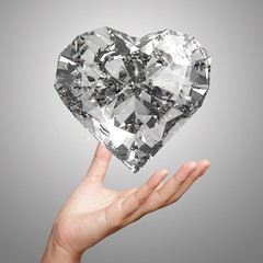 Wall Mural - hand holding 3d diamond heart shape as concept