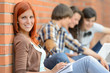 © CandyBox Images - Young student woman friends sitting in background