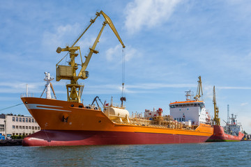 Loading a ship in the harbor