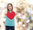 © Syda Productions - smiling little girl giving red heart