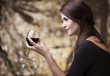 Elegant glamour woman with glass of red wine