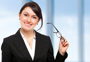 Canvas Print - Businesswoman holding her glasses