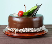 Festive Beautiful Chocolate Cake With Icing And Cherry