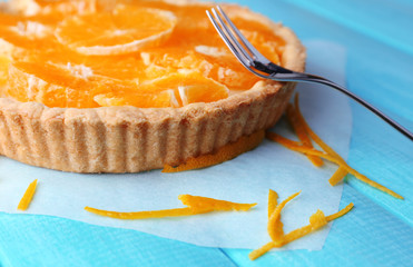 Sticker - Homemade orange tart on color wooden background