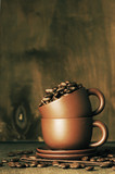 Fototapeta Panele - Coffee beans in cup