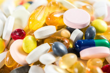 Close-up Of Pills And Capsules And Tablets On White Background