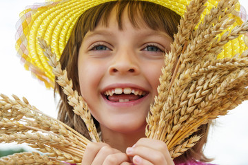 happy little girl and wheat