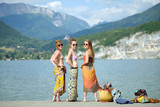 Fototapeta  - Three young women at the beach