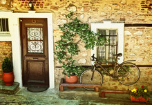 Black  Bicycle Against Old House Wall.